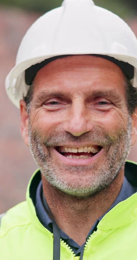 Smile, man and face on construction site for confidence, management and property Stock Footage 340951493