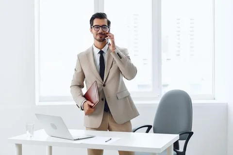 Smile man computer winner laptop call businessman mobile talk phone phone video Stock Photos