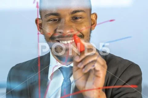 The smile man draw the graph at the virtual screen Stock Photos