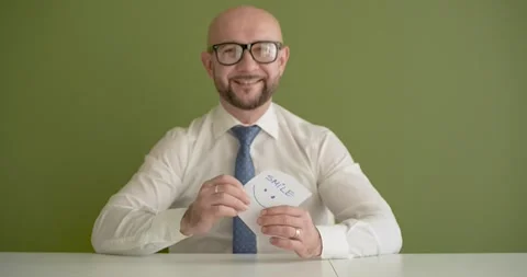 Smile   - A man presents a note with the word Stock Footage 267088459
