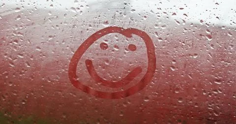 Smile on the misted window Stock Photos