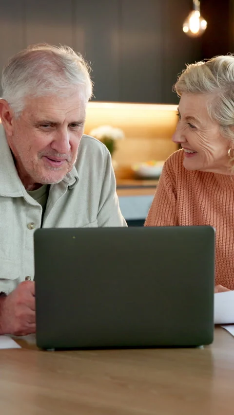 Smile, old couple and document in home with laptop, research and statement for Stock Footage 337496373
