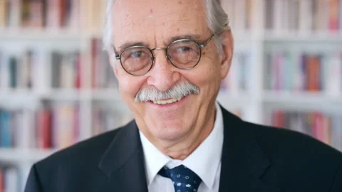 Smile, professor and face of man in library for about us, course lecturer and Stock Footage 336701804