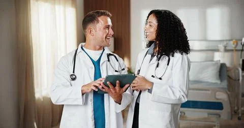 Smile, tablet and teamwork with doctors in hospital together for advice Stock Photos