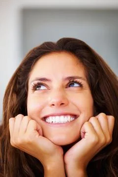Smile, thinking and face of young woman with hands on her chin for dreaming and  Stock Photos