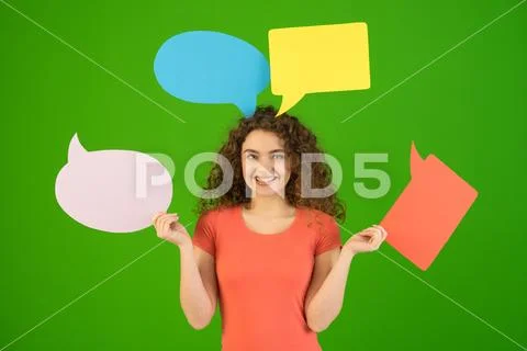 The smile woman with dialog signs on the green background Stock Photos