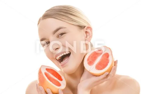 The smile woman holding a grapefruit on the white background Stock Photos