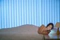 The smile woman lay on the bed and phone. Evening night time Photo