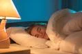 The smile woman sleeping on the bed Photo