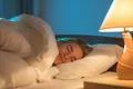 The smile woman sleeping on the bed Photo