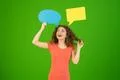 The smile woman stand with dialog signs on the green background Photo