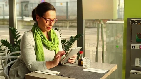 Smile woman using tablet in the cafe  Stock Footage 70998711
