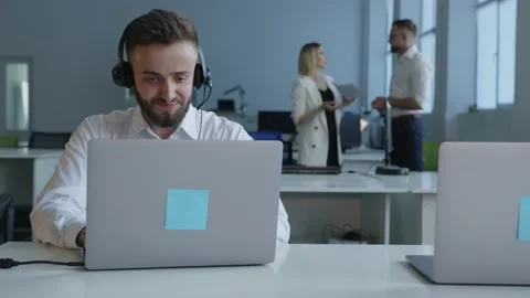 Smiled man sit on a laptop's screen and move their hands Vídeo Stock 157671943