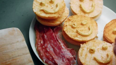 Smiley burger buns waiting for final assembly, 4K Stock Footage 341117563