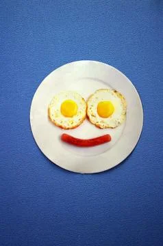 Smiley face on blue background Stock Photos