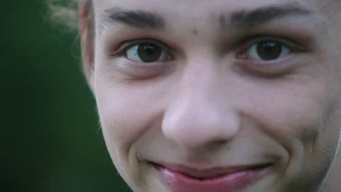 Smiley face closeup , young boy outdoors in the evening Video stock 96217007