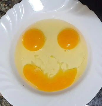 Smiley face with eggs 库存照片
