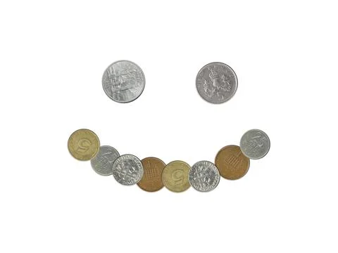 Smiley  face emoji with old coins on white background Stock Photos