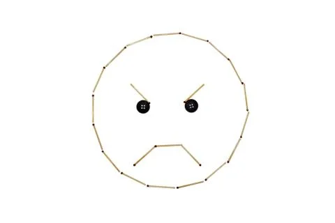 Smiley face outrage is made out of matches Stock Photos