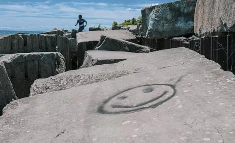 Smiley face on a rock Stock Photos