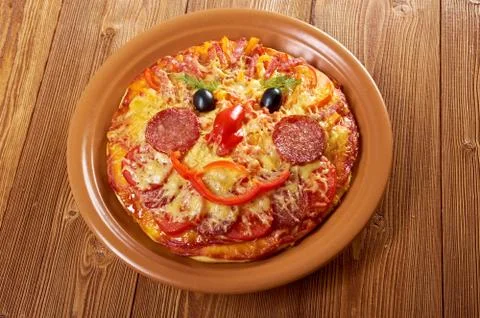 Smiley faced pizza Stock Photos