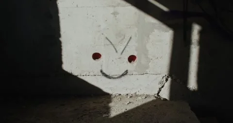 Smiley graffiti shadow play on a wall Stock Footage 273449008