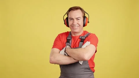 Smiley mature worker looking at camera in work uniform Stock Footage 232307006