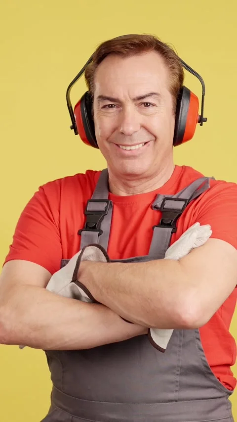 Smiley mature worker looking at camera in work uniform Stock Footage 239262742