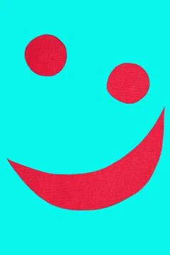 Smiley on red fabric Stock Photos