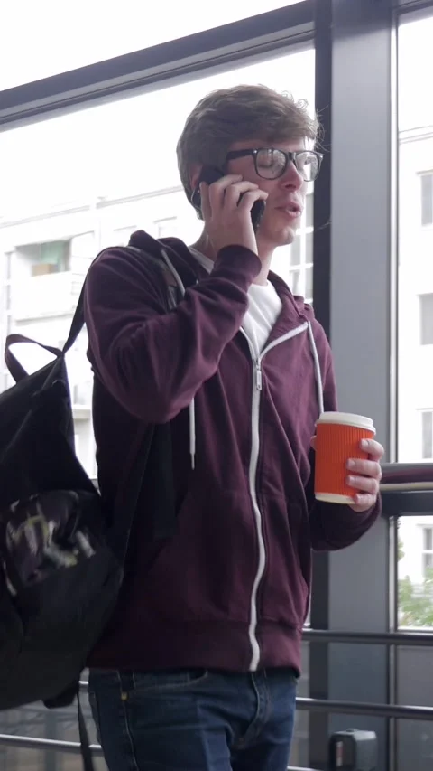 Smiley Student Walking And Using Mobile Phone For Remote Conversation Stock Footage 301544953