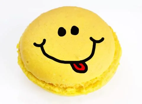 Smiley on yellow macaroon Stock Photos