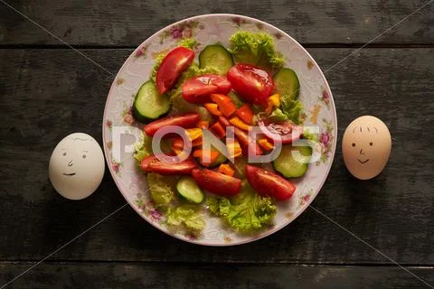 Smilies eggs and healthy salad Stock Photos