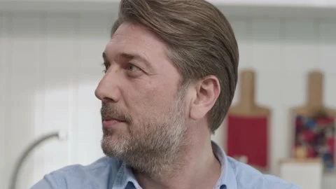Smiling 40s white-haired man in kitchen. Stock Footage 188974788
