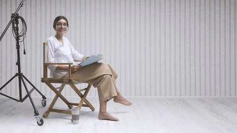 Smiling actress reading the play script Stock Photos