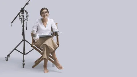 Smiling actress reading the play script Stock Photos