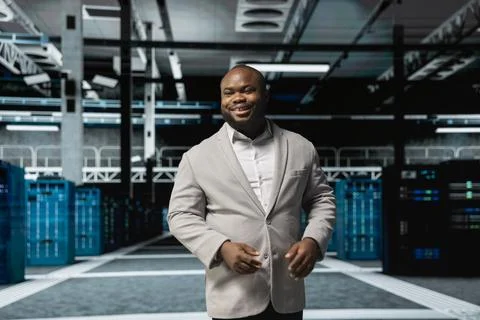 Smiling admin doing yearly checkup to prolong data center electronics life span Stock Photos