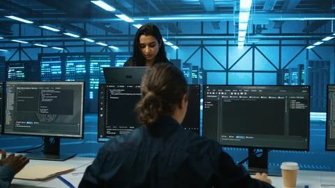 Smiling admin in server hub checking recovery plan, monitoring data center Stock Photos