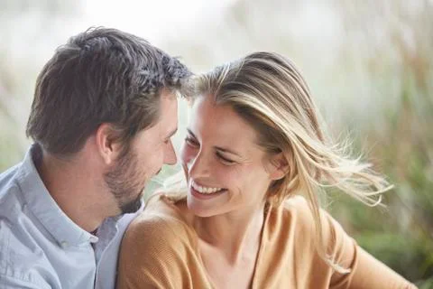 Smiling affectionate couple face to face Stock Photos