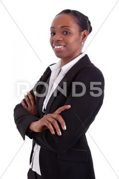 Smiling african american businesswoman with folded arms Stock Photos