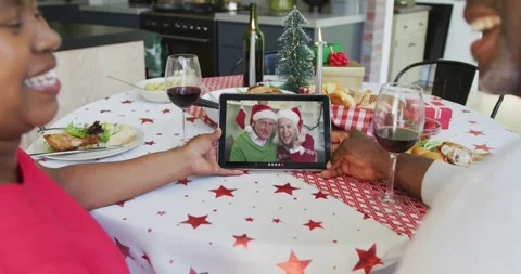 Smiling african american couple using tablet for christmas video call with happy Video stock 331206355