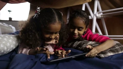 Smiling african american girls using tablet pc Stock Footage