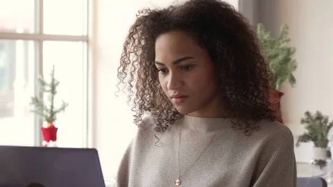 Smiling african american young woman work using laptop Stock Footage