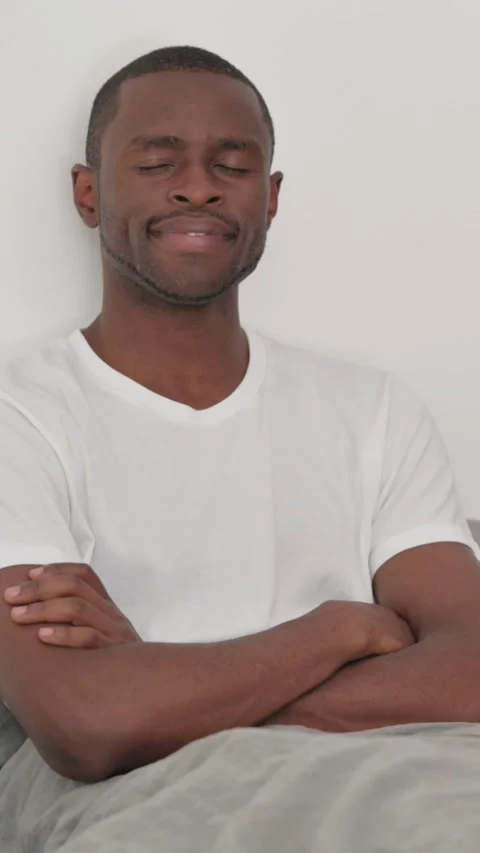 Smiling African Man Looking at Camera in Bed Stock Footage 301855867