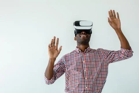 Smiling afro american man using VR gadget Stock Photos
