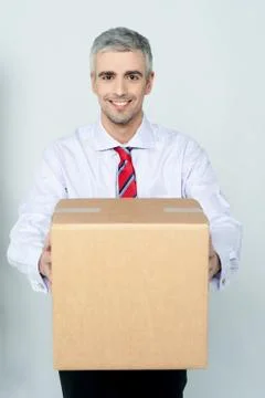 Smiling aged delivery man Stock Photos