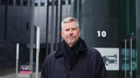 A smiling and happy middle aged man in an urban city center looking at camera. Stock Footage 165208954
