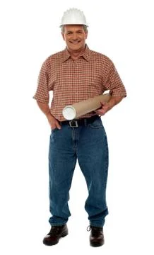 Smiling architect posing with blueprints Stock Photos