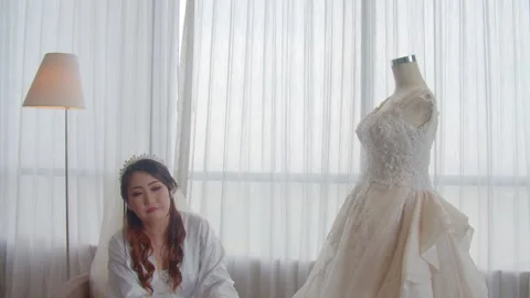 Smiling Asian Bride Touching Her Wedding Dress Outdoors Видео 333358623