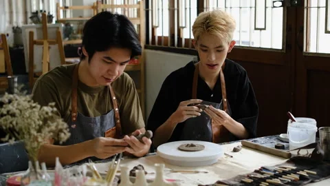 Smiling asian man learning creating handcrafted ceramics during art and craft Stock Footage 244320572