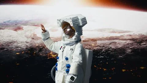 Smiling astronaut preparing to land on outer space planet, rotating 360 degrees Stock Photos